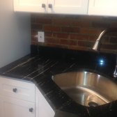 Added receptacle inside a course of brick !  Not an easy task ! However well worth the investment to keep sleek kitchen look.