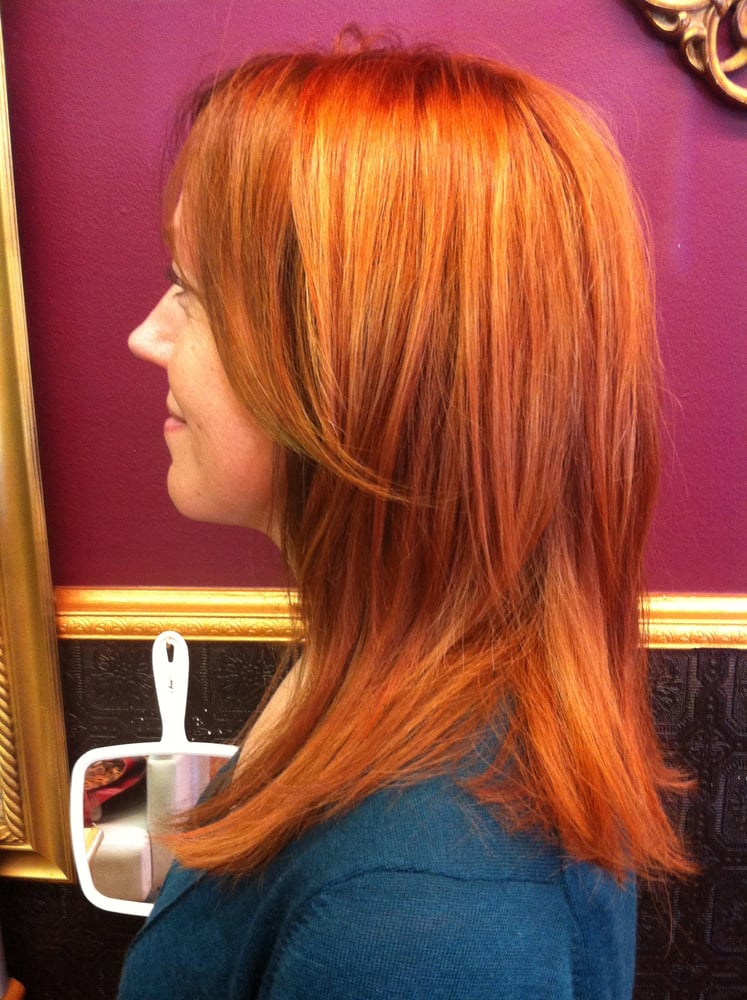 Dimensional copper red hair that matches her skin tone impeccably. Yelp